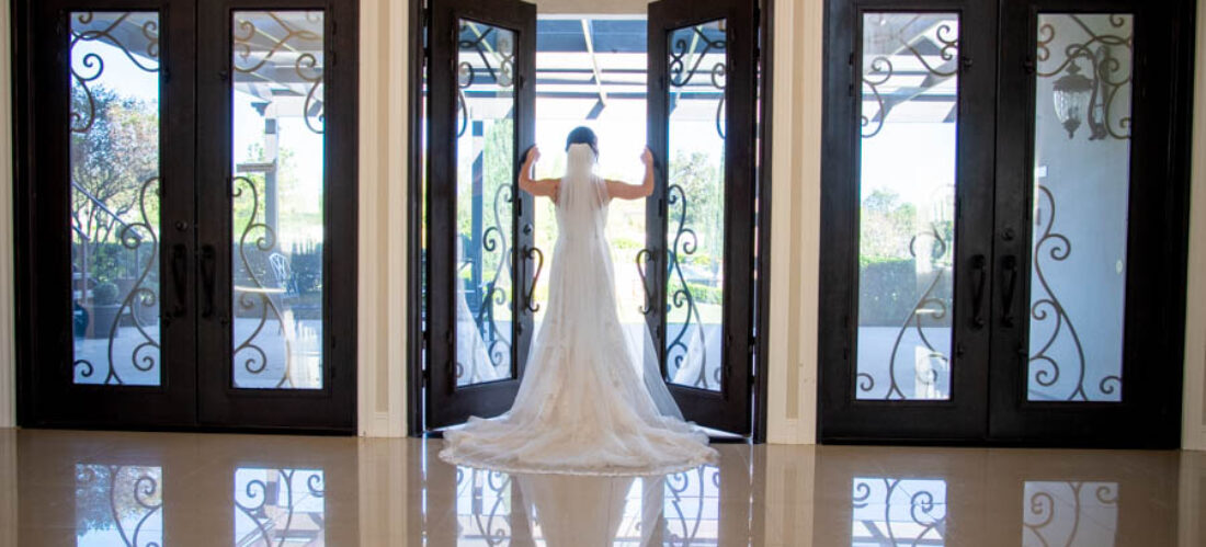 thistlewood manor bridal portrait by entrance doors